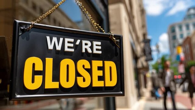 Closed Sign on Business: The We're Closed sign boldly displays, a symbol of temporary unavailability, hanging outside a business storefront.