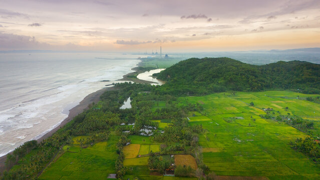 Aerial view of karang agung beach in java, showcasing its stunning landscape. Perfect for travel brochures and websites.