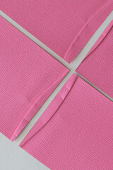 four textured pink paper with folded element