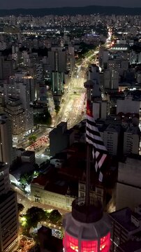 Santander Lighthouse At Sao Paulo In Brazil. Illuminated City Landscape. Downtown City Scenery. Highrise Buildings. Santander Lighthouse At Sao Paulo In Brazil. Business Skyscrapers. Sao Paulo Brazil.