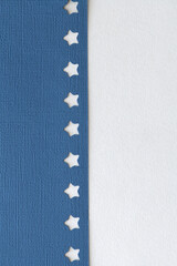 textured navy blue paper with star cutout border