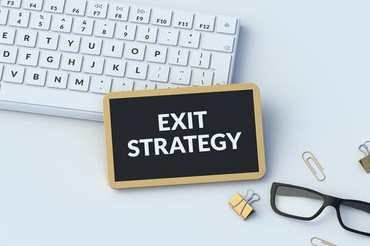 Exit strategy words on chalkboard on workplace. Liquidation plan. Business exit. Corporate roadmap. Risk management. Asset sale. Divestment concept. 3d render