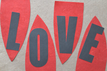 abstract paper sign with the word love