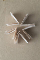 folded paper shapes arranged in radial form on brown