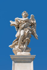 Obraz premium Italy - Rome - Sant'Angelo Bridge - Bernini's angel sculpture gracefully holds sacred inscription scroll from Christ's Passion