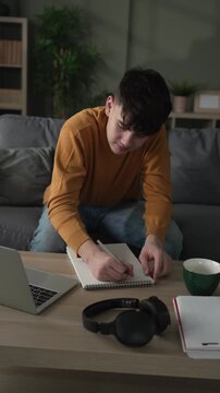 Caucasian male teenage student attending online class from home