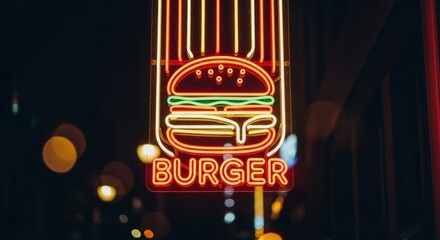 Neon burger sign glows with bright reds and yellows against a dark, blurred backdrop