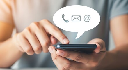 Close-up of a person's hands using a smartphone, with a speech bubble displaying icons for phone, email, and social media.