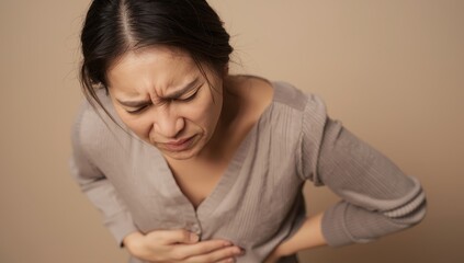 Fototapeta premium Asian woman with stomach pain, health issue