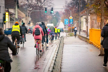 Fototapeta premium Group of cyclists on city road, street, asphalt