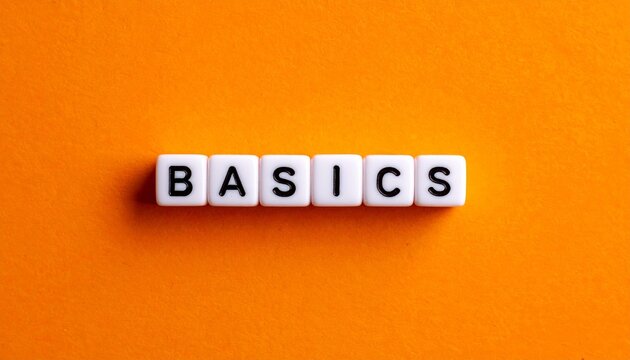 &ldquo;Basics&rdquo; Word on White Tiles with Orange Background Showcasing Simplicity, Foundational Concepts, and Educational Design