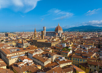 Obraz premium Aerial view of Florence city skyline featuring the iconic Duomo Cathedral of Santa Maria del Fiore under a clear blue summer sky, Tuscany, Italy