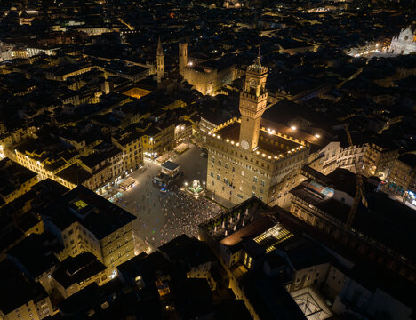 Aerial night view of Piazza della Signoria with Palazzo Vecchio illuminated in the historic center of Florence. One of Italy&rsquo;s most iconic squares surrounded by medieval architecture
