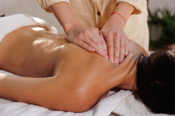Closeup Oil Back Massage Therapy in Outdoor Spa Wellness Setting