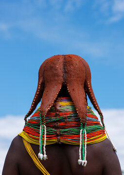 Rear view of a Mwila tribe woman with vilanda necklaces, Huila Province, Chibia, Angola