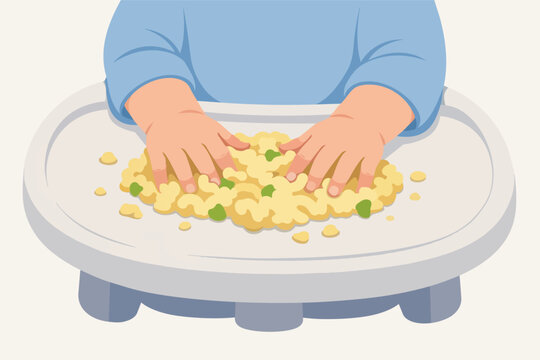 Baby exploring food with hands during self-feeding in high chair tray