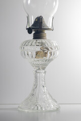 Antique kerosene lamp with clear glass and brass detail