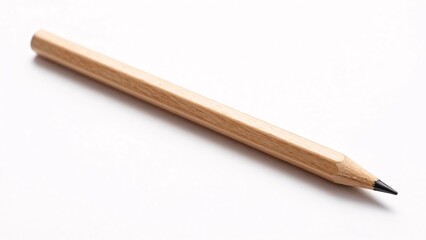 Fototapeta premium A single sharpened natural wood pencil lies isolated on a clean white background, representing creativity, education, and simple design.