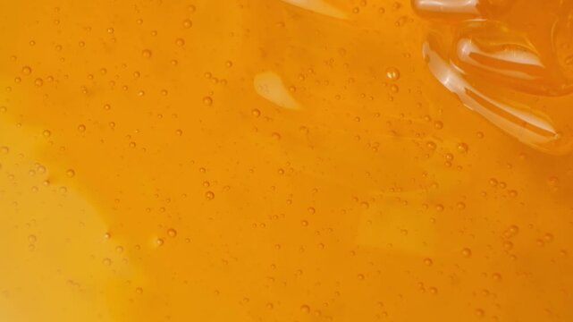 Macro texture of fresh bee honey, honey cooking background