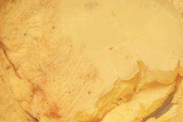 Abstract texture background of yellow cheese surface. Copy space for text. For graphic design, 3D rendering and banners