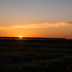 Renewable Energy Milestone A country achieving 100% renewable energy, with landscapes dotted with wind turbines and solar panels.