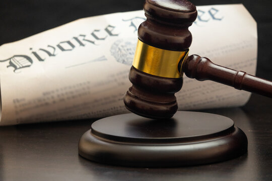 Divorce Decree and Judicial Gavel and Hammer Symbolizing Justice Law Courtroom Authority