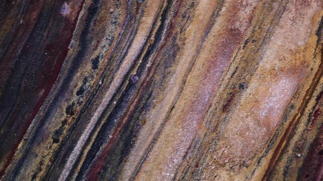 Rainbow Cave on Hormuz Island, Iran, showcasing naturally colorful rock formations and mineral layers. Unique geological landscape, natural wonder, travel destination, earth textures, vibrant colors, 