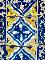 Blue and yellow Talavera ceramic tile pattern seamless Mexican texture background