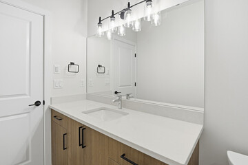 Bathroom with a white sink and a mirror