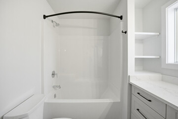 Bathroom with a white toilet and bathtub