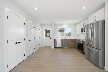 Kitchen with a stainless steel refrigerator and microwave