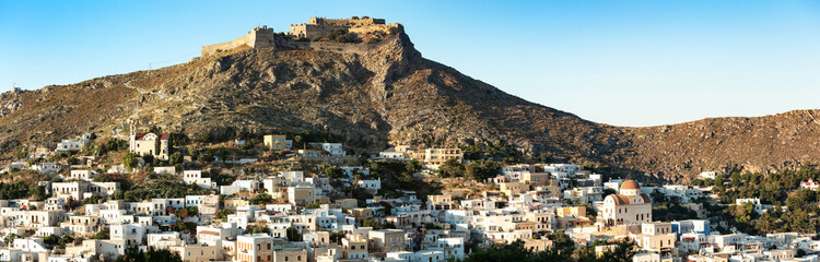 Panoramic Sunset View of Platanos Town with White Houses and Medieval Byzantine Castle on Hilltop Leros Island Authentic Mediterranean Aesthetic Dodecanese Greece Travel