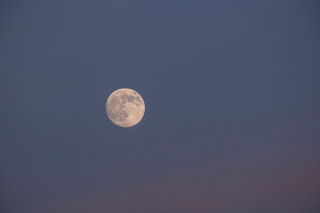 Lunar Craters Visible on the Moon. Moon Close-Up in the Night Sky. Full Moon in a Clear Night Sky. Detailed Moon Surface Against Dark Sky. © onderortel