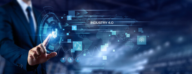 Fototapeta premium Businessman touching Industry 4.0 and networking. Smart manufacturing, industrial automation, cyber physical system, digital factory, advanced production, future industry concept.