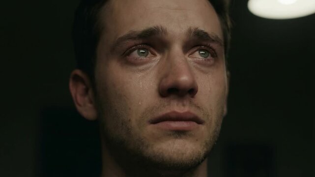 Close up portrait of sad man looking upward depressed