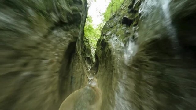 Gorge perspective: A daring perspective plunges into a gorge, showcasing its dramatic rock formations, offering a glimpse of the natural beauty.  FPV drone perspective landscape animation