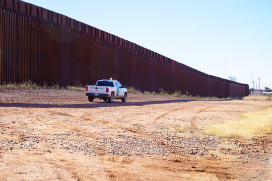 Naco, Arizona - January 16, 2026: US Border Patrol vehicle truck drives along the US Mexico border wall in southern Arizona