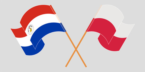 Crossed and waving flags of Republic of Paraguay and Poland. Vector illustration