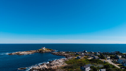 Aerial view featuring the Cape Neddick Nubble Lighthouse in York, Maine