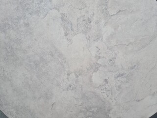 Obraz premium Close-up of a smooth, light gray textured surface with subtle variations and patterns. Ideal for backgrounds or design elements.