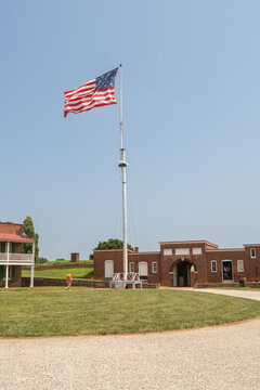 Baltimore, Maryland, US - July 26, 2023: American flag flying high atop the historic site of fort Mchenry