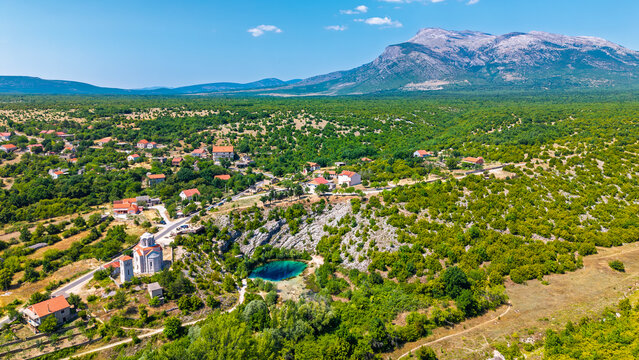 Iconic Eye of the Earth spring karst sinkhole source of Cetina River Croatia aerial view
