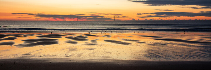 Sunrise and colourful morning light on Blyth Beach on the coast of Northumberland, England, UK. © coxy58