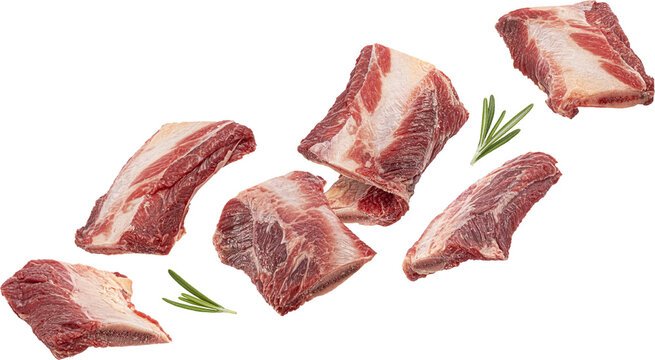 Falling raw beef rib pieces isolated