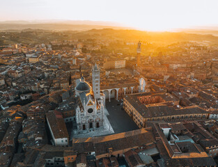 Obraz premium Aerial view of Siena Cathedral and historic city center at sunset, Tuscany, Italy