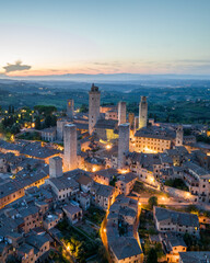 Aerial night view of San Gimignano medieval towers, Tuscany, Italy