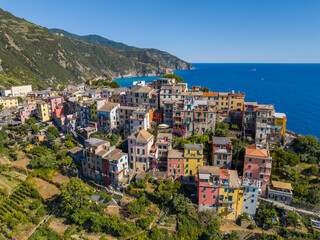 Obraz premium Aerial view of Corniglia, the only Cinque Terre village not directly on the sea, perched high on cliffs overlooking the Mediterranean coastline