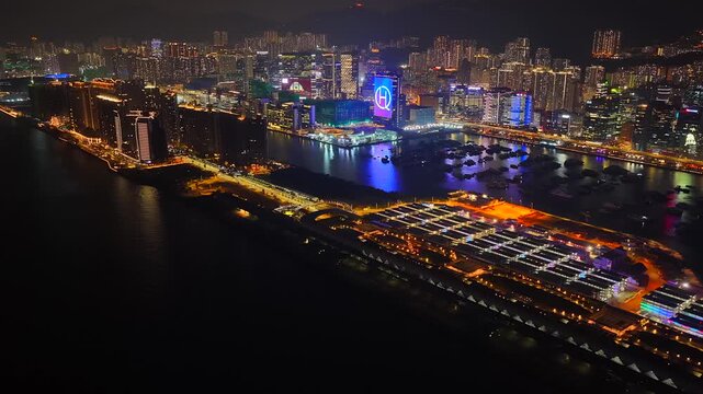Drone Aerial Skyview of a Mega Luxury Cruise Ship is docking at the Kai Tak cruise terminal near Kai Tak Sports Park Kwun Tong Kowloon Victoria Harbour Hong Kong