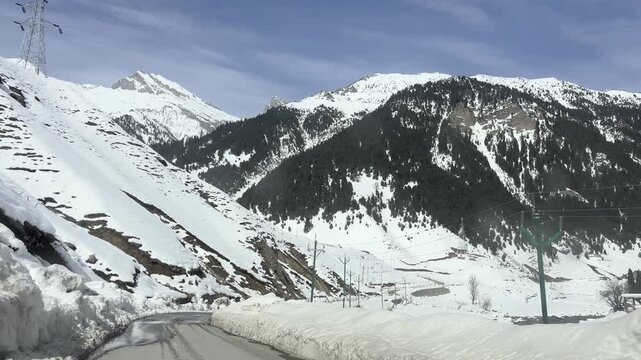 Scenic video of the mountain road and pathway leading to Sonmarg, passing through lush valleys, flowing rivers, and majestic Himalayan landscapes in Jammu and Kashmir.