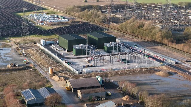 Aerial view of the Walpole Substation, a symphony of steel and power amidst the flat landscape, Wisbech, United Kingdom.